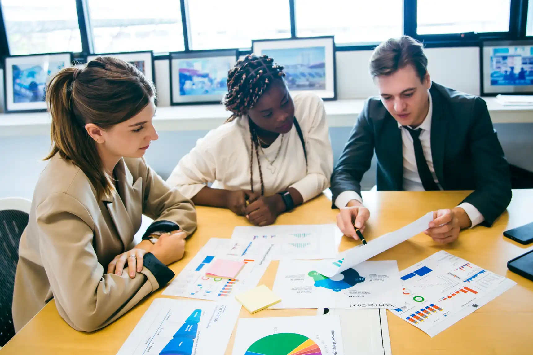 business-team-meeting-with-stats-and-review-graphs-2024-03-25-20-54-58-utc
